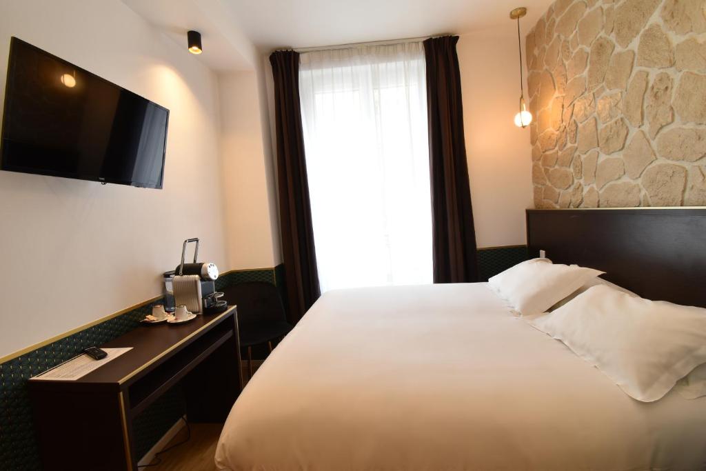 Двухместный (Двухместный номер с 1 кроватью или 2 отдельными кроватями) отеля Hôtel Bonne Nouvelle, Париж