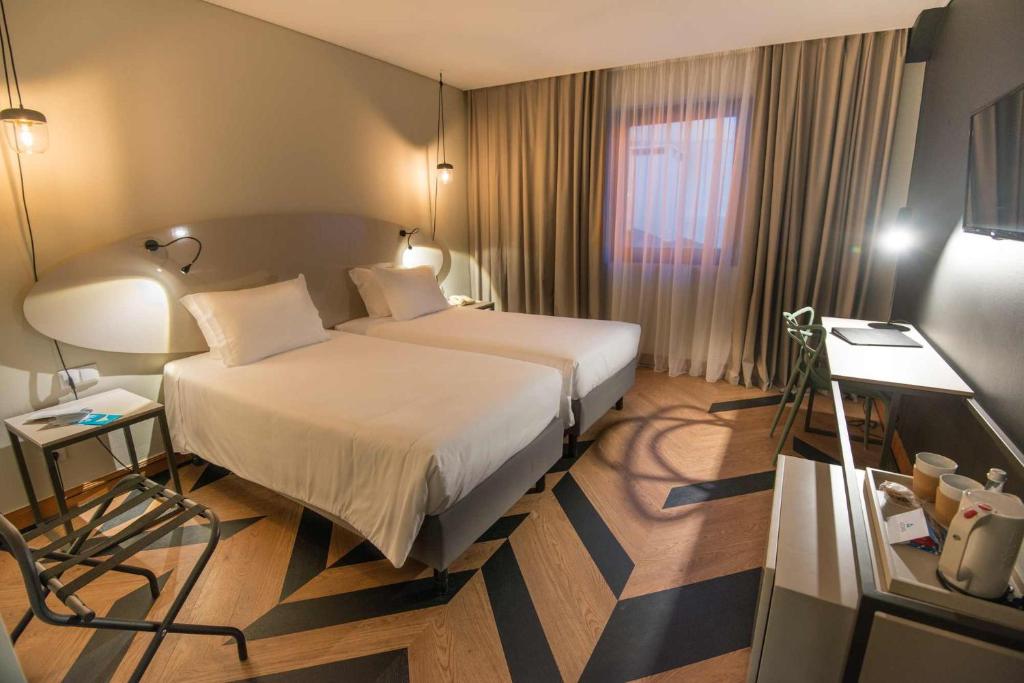 Двухместный (Двухместный номер с 2 отдельными кроватями) отеля Azoris Angra Garden – Plaza Hotel, Ангра-ду-Эроижму