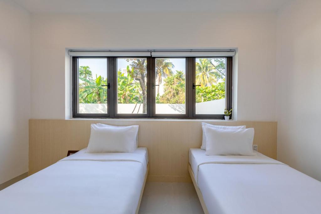 Двухместный (Двухместный номер Делюкс с 1 кроватью или 2 отдельными кроватями, вид на сад) апарт-отеля Bespoke Villa Hoian, Хойан