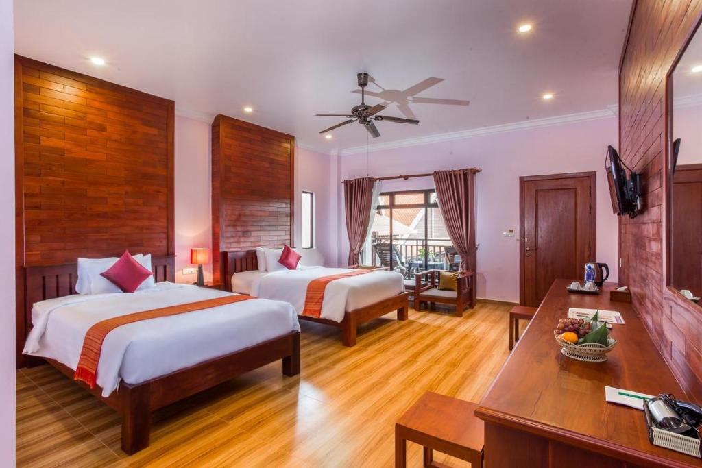 Двухместный (Двухместный номер Делюкс с 2 отдельными кроватями - Вид на сад и бассейн - Бесплатный трансфер до отеля) отеля Angkor Angel Boutique Villa, Сием Рип