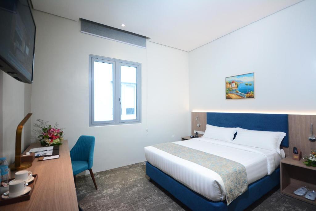 Двухместный (Улучшенный номер с кроватью размера «queen-size») отеля Blue Lotus Hotel, Давао