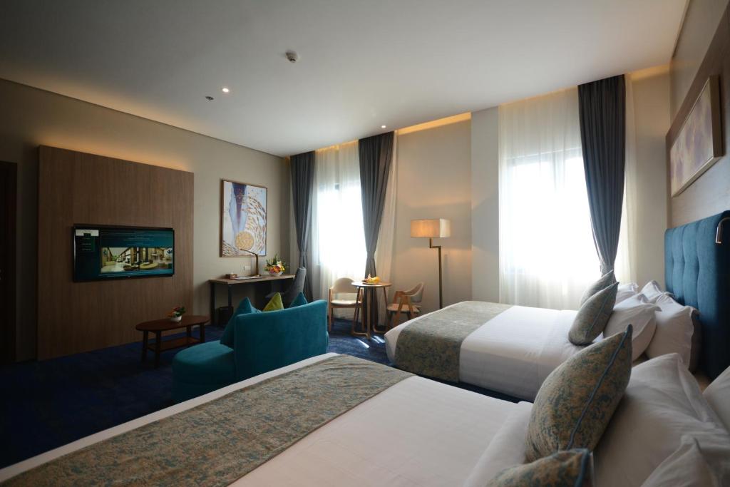 Сьюит (Двухместный полулюкс с 2 отдельными кроватями) отеля Blue Lotus Hotel, Давао