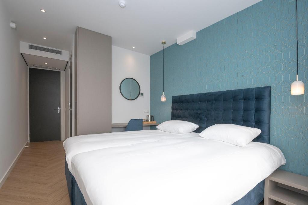 Двухместный (Двухместный номер Делюкс с 2 отдельными кроватями) отеля Hotel Royal, Нордвейк