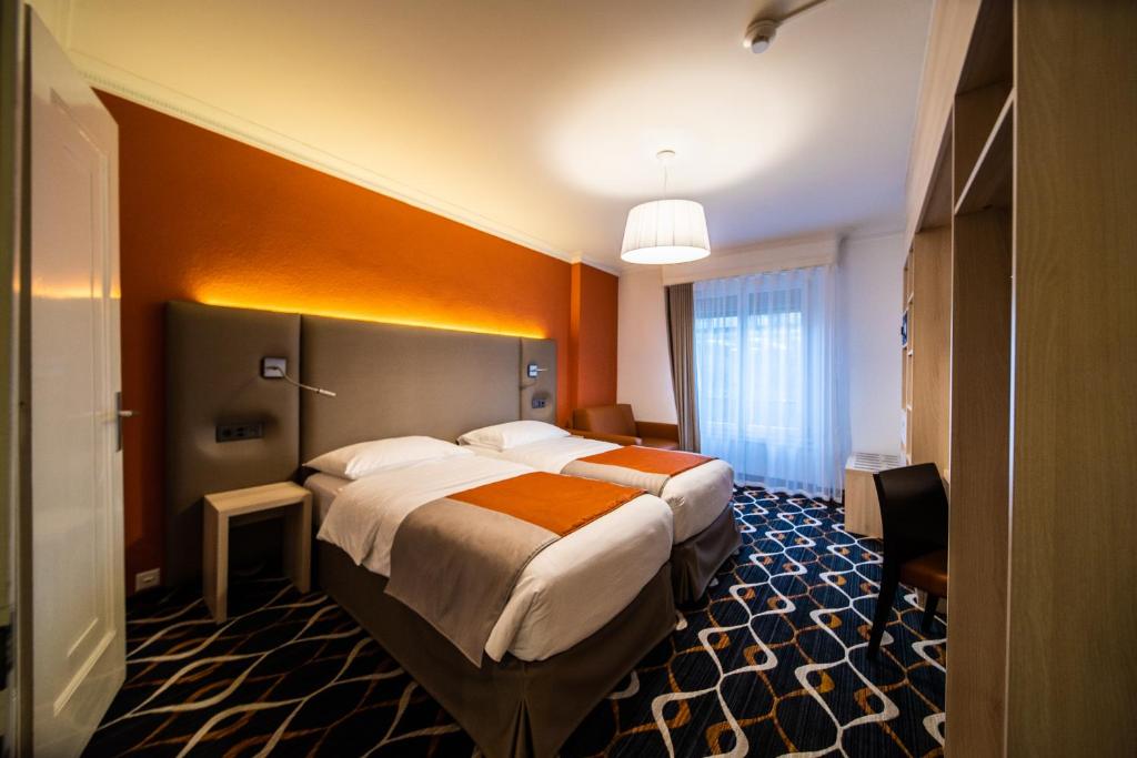 Двухместный (Стандартный двухместный номер с 2 отдельными кроватями) отеля Hotel Eden, Женева