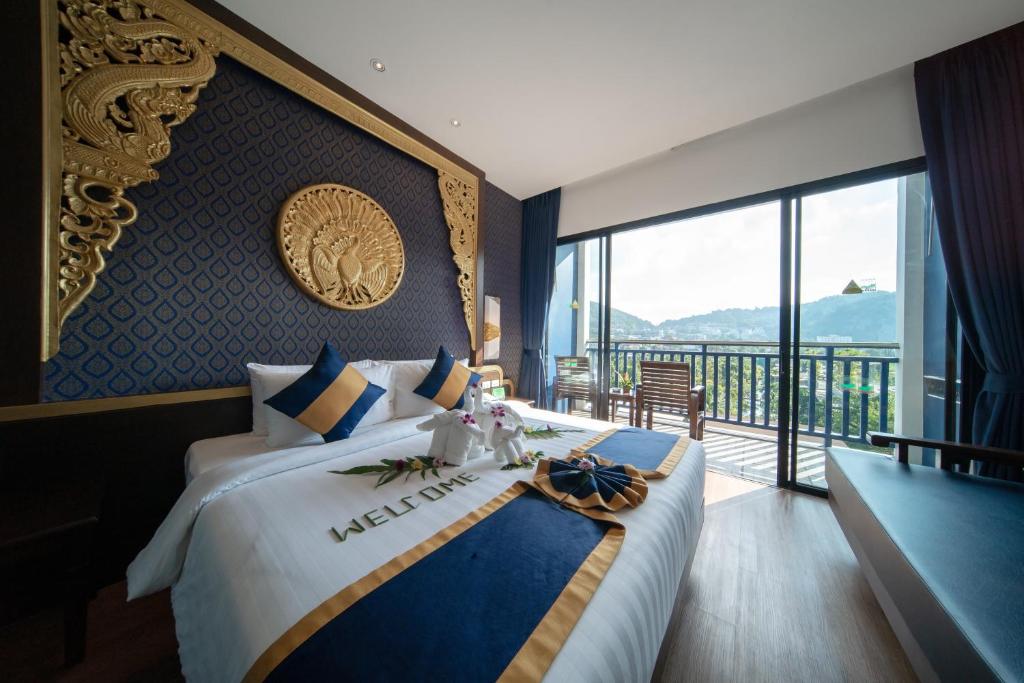 Двухместный (Улучшенный королевский номер «Синее крыло») курортного отеля Kata Palm Resort & Spa, Пхукет