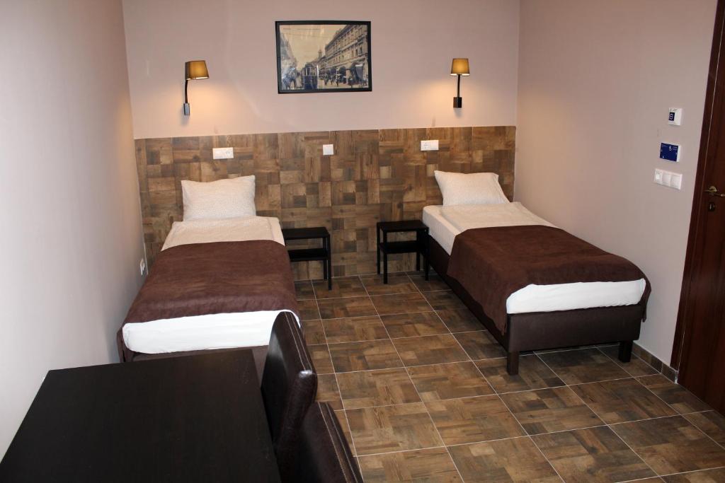 Двухместный (Двухместный номер с 1 кроватью или 2 отдельными кроватями - Подходит для гостей с ограниченными физическими возможностями) отеля Promenade Pension, Мишкольц