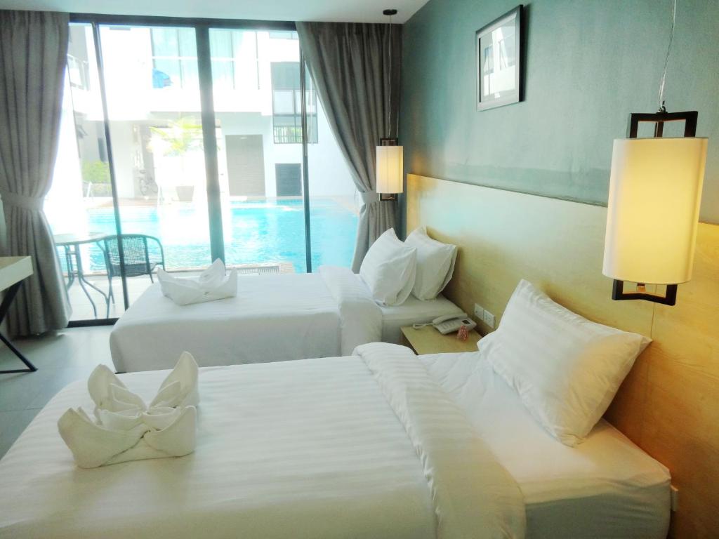 Двухместный (Стандартный двухместный номер с 2 отдельными кроватями и выходом к бассейну) отеля Good Day Phuket Boutique Bed & Breakfast, Пхукет