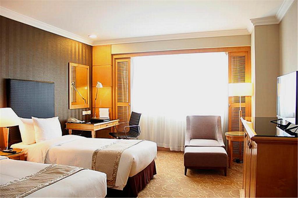 Двухместный (Клубный двухместный номер «Кристалл» с 2 отдельными кроватями) отеля Grand Park Wuxi, Уси