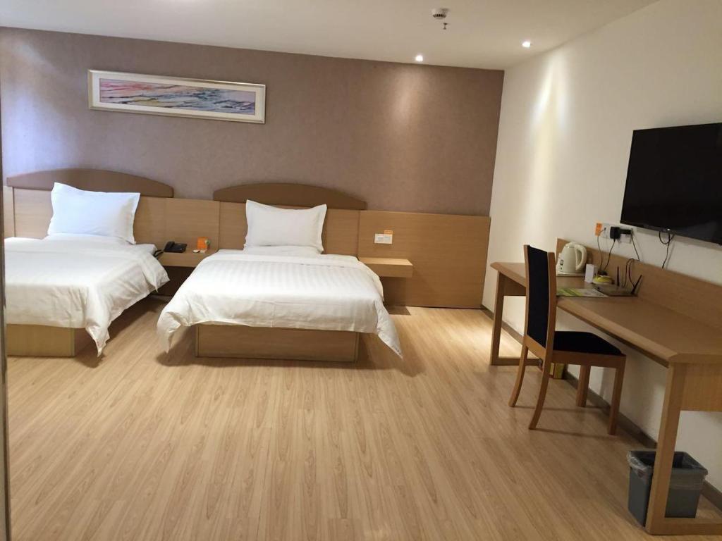 Двухместный (Двухместный номер бизнес-класса с 2 отдельными кроватями) отеля 7Days Inn Chengdu Yushuang Road, Чэнду