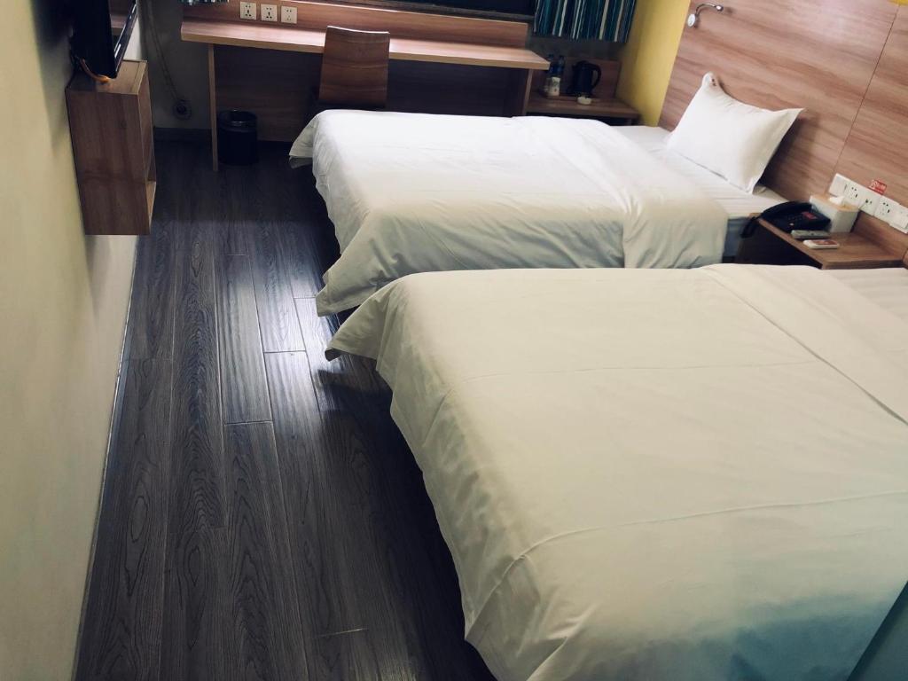 Двухместный (Двухместный номер бизнес-класса с 2 отдельными кроватями) отеля 7Days Inn Chengdu Shuangnan, Чэнду