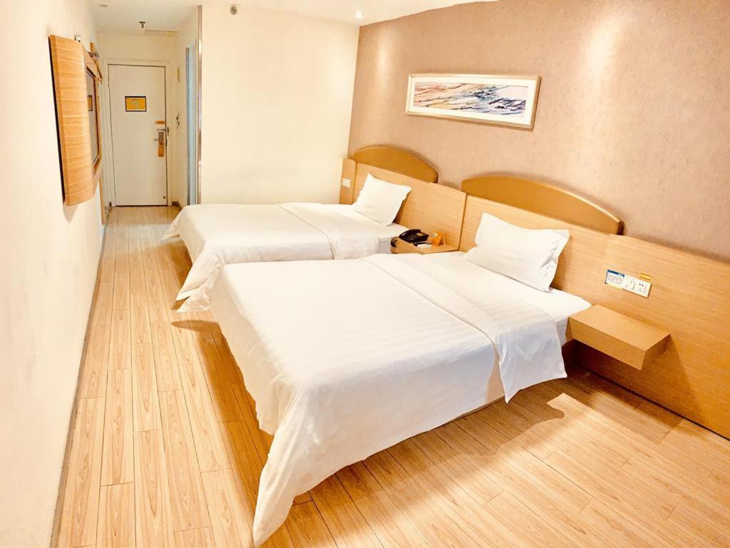 Двухместный (Двухместный номер бизнес-класса с 2 отдельными кроватями) отеля 7Days Inn Chengdu Kuanzhai Xiangzi Vancouver Square, Чэнду