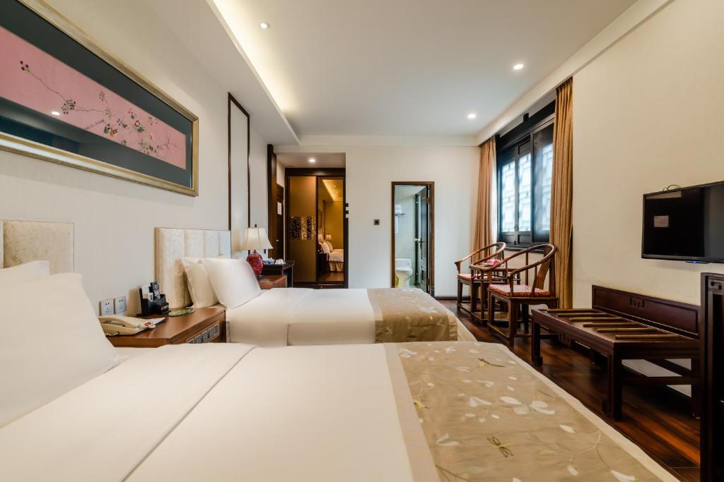 Двухместный (Улучшенный двухместный номер с 2 отдельными кроватями) отеля Buddha Zen Hotel, Чэнду