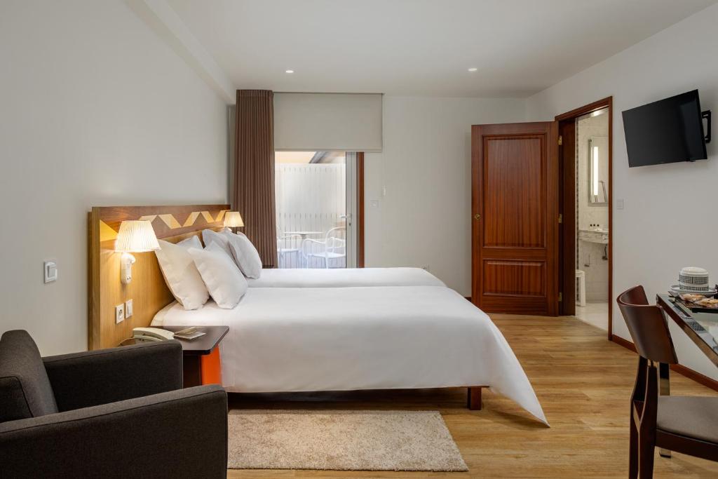 Двухместный (Двухместный номер с 2 отдельными кроватями - Подходит для гостей с ограниченными физическими возможностями) отеля Hotel Aveiro Center, Авейру
