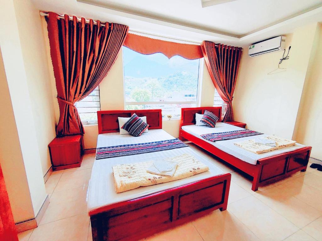 Четырехместный (Номер с 2 кроватями размера «queen-size») семейного отеля Hoang Kim Hotel, Хазянг