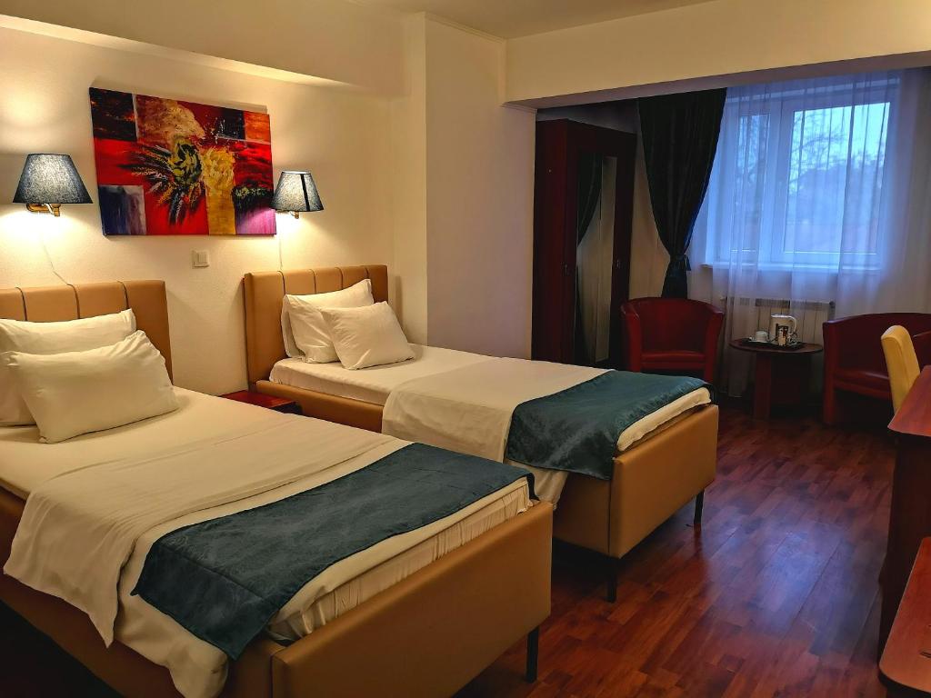 Двухместный (Стандартный двухместный номер с 2 отдельными кроватями) отеля Hotel Armonia, Бухарест