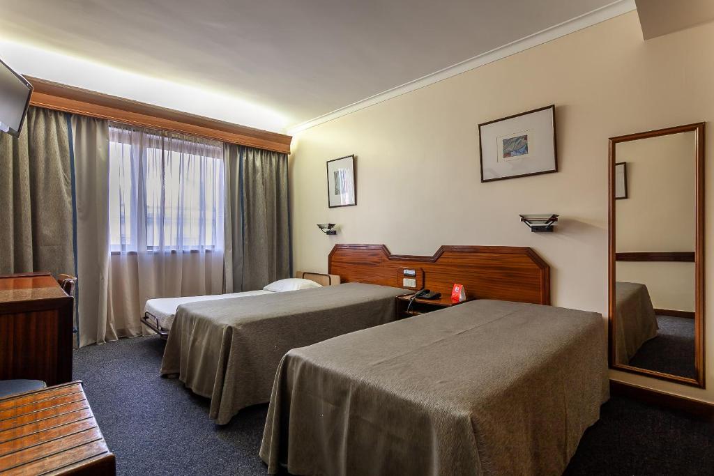 Двухместный (Двухместный номер с 2 отдельными кроватями и дополнительной кроватью) отеля Hotel Nacional, Лиссабон