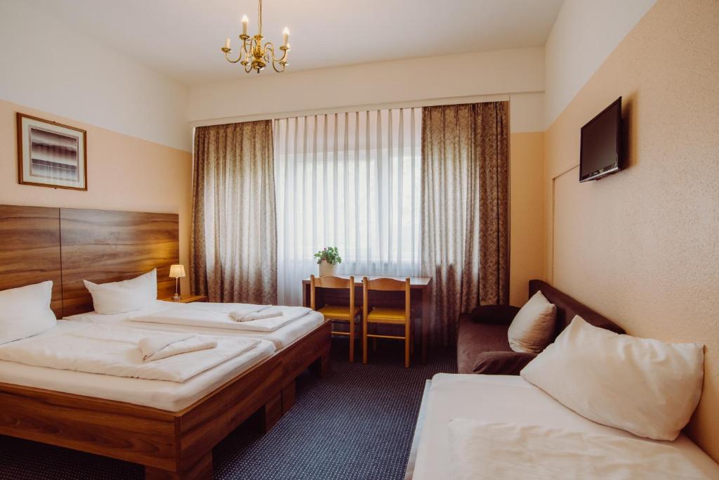 Трехместный (Трехместный номер) отеля Alper Hotel am Potsdamer Platz, Берлин