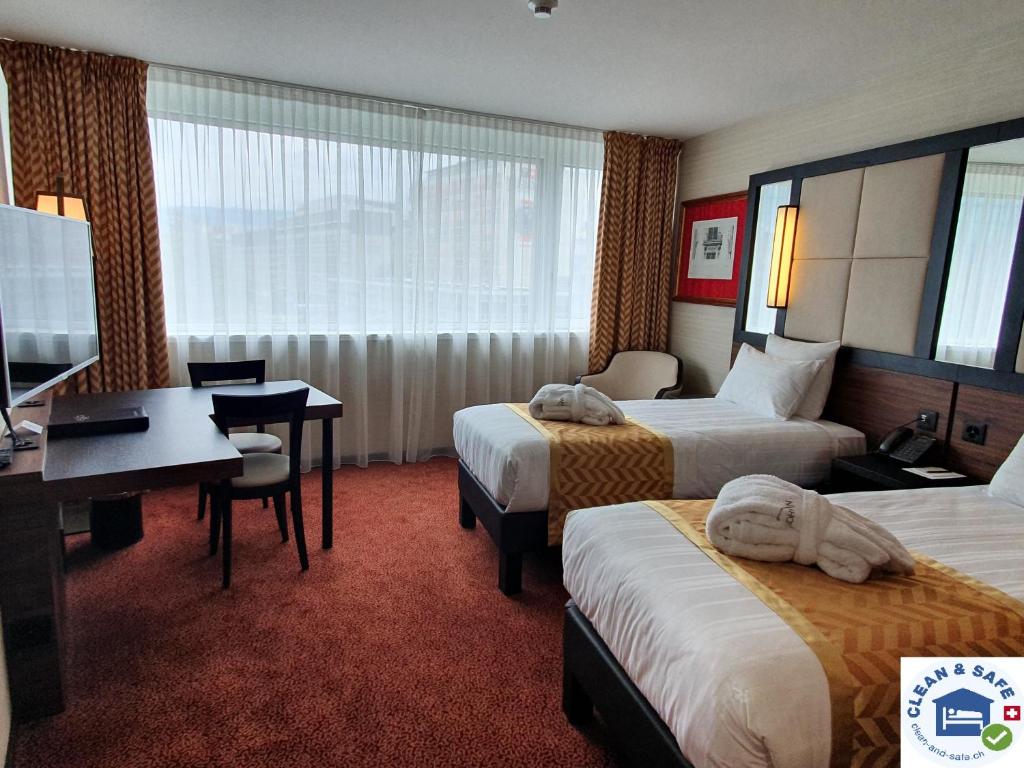 Двухместный (Улучшенный люкс Твин) отеля Nash Suites Hotel, Женева