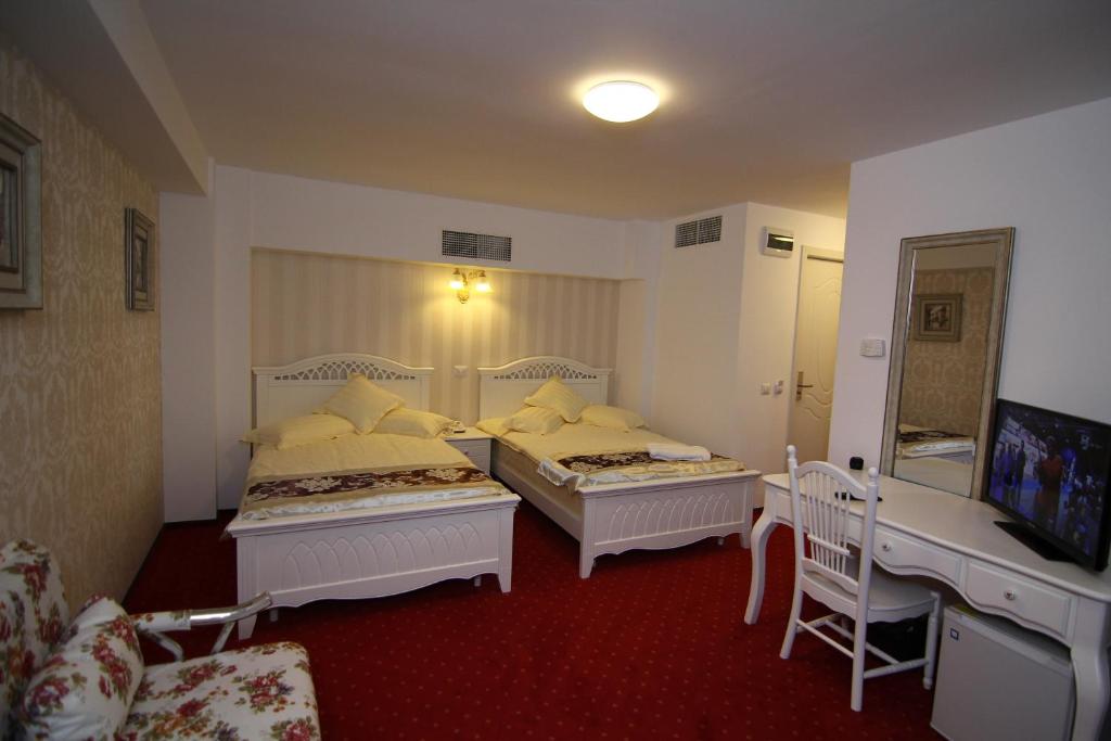 Двухместный (Улучшенный двухместный номер с 1 кроватью или 2 отдельными кроватями) отеля Hotel Helin Central, Крайова