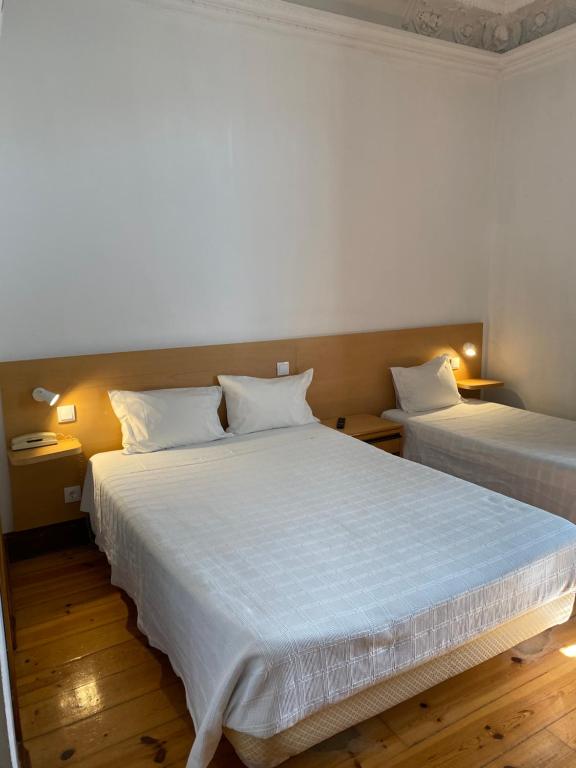 Трехместный (Двухместный номер с 1 кроватью и отдельной дополнительной кроватью) гостевого дома Lusa Atenas, Коимбра