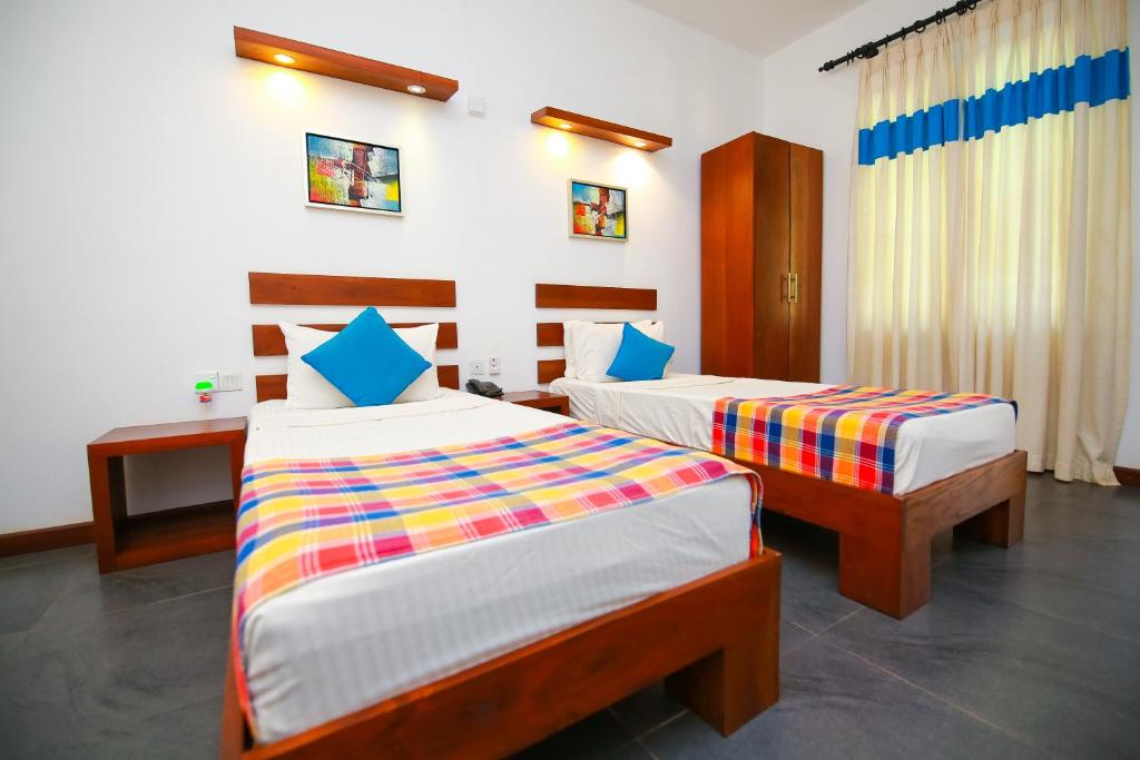 Двухместный (Двухместный номер с 1 кроватью или 2 отдельными кроватями) отеля Hotel Alakamanda, Анурадхапура