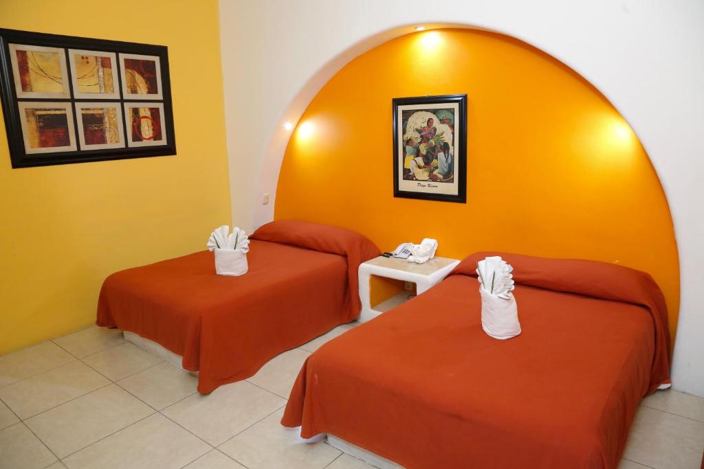 Двухместный (Двухместный номер с 2 двуспальными кроватями) отеля Hotel Alikar, Санта-Крус-Хуатулко