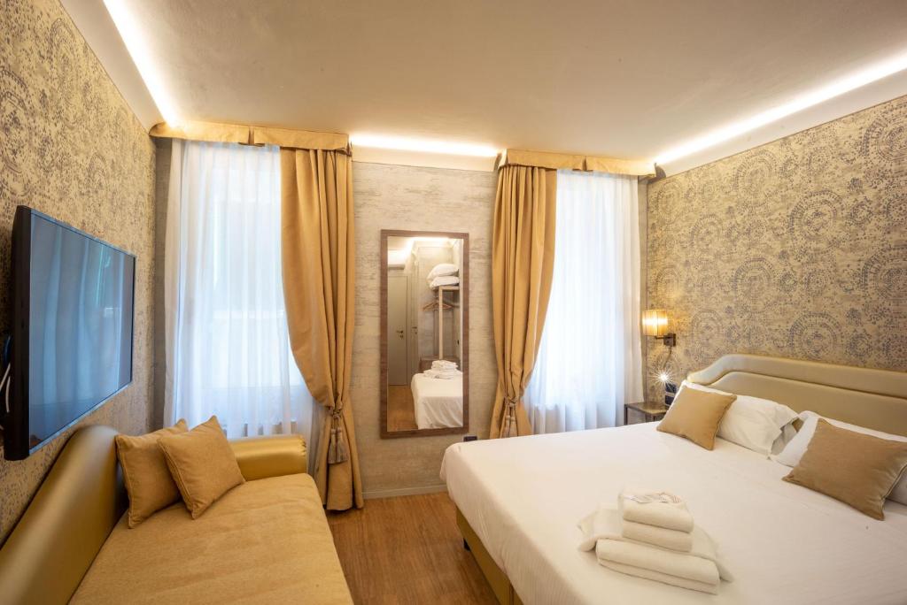 Трехместный (Улучшенный трехместный номер) отеля Locanda Cavanella, Венеция