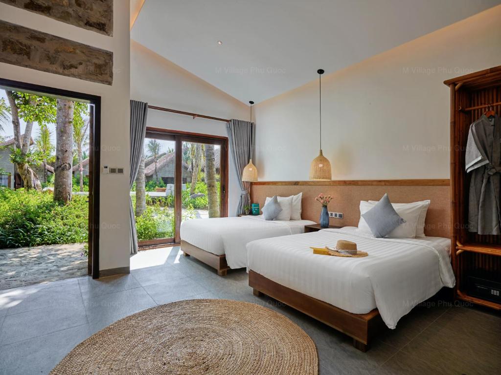 Двухместный (Двухместный номер с 2 отдельными кроватями и видом на сад) курортного отеля M Village, Дуонг-Донг