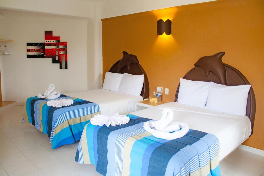 Двухместный (Стандартный двухместный номер с 2 двуспальными кроватями) отеля Hotel Bahia Huatulco, Санта-Крус-Хуатулко