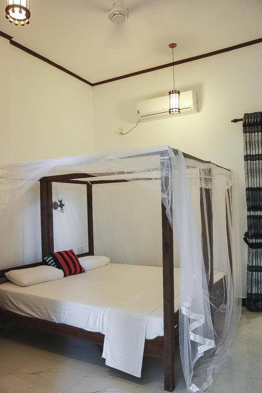Двухместный (Двухместный номер Делюкс с 1 кроватью или 2 отдельными кроватями и видом на озеро) гостевого дома Sunset View Beach Hotel, Аругам