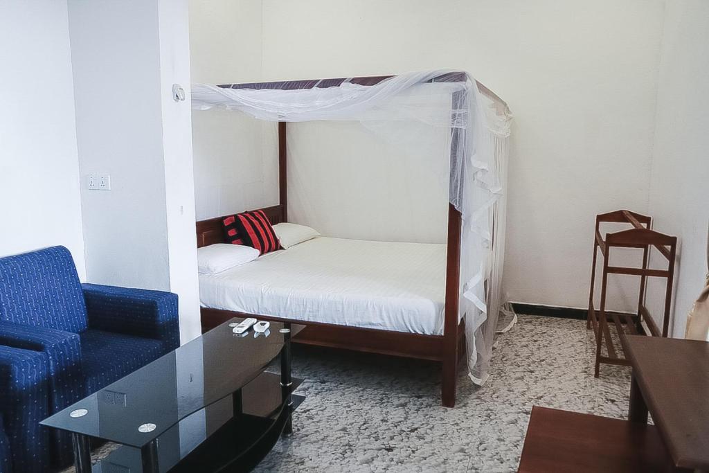 Двухместный (Двухместный номер Делюкс с 1 кроватью (для 2 взрослых и 1 ребенка)) гостевого дома Sunset View Beach Hotel, Аругам