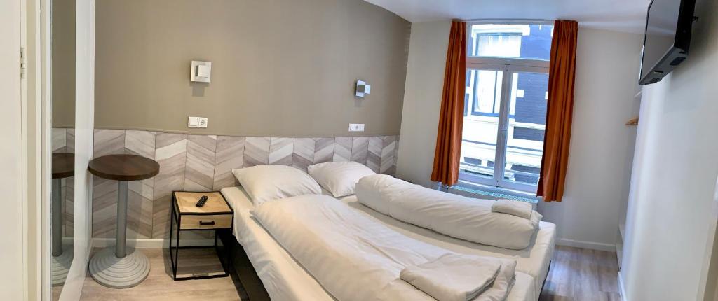 Двухместный (Двухместный номер с 2 отдельными кроватями) отеля Hotel Damrak Inn, Амстердам