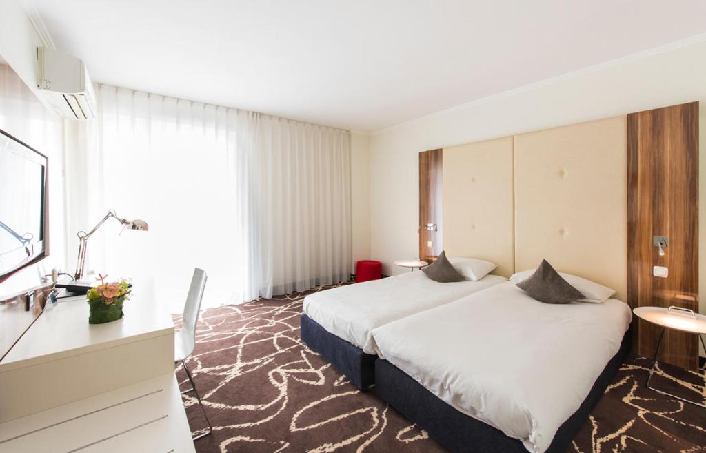 Двухместный (Стандартный двухместный номер с 2 отдельными кроватями) отеля Ambassador Hotel, Франкфурт-на-Майне