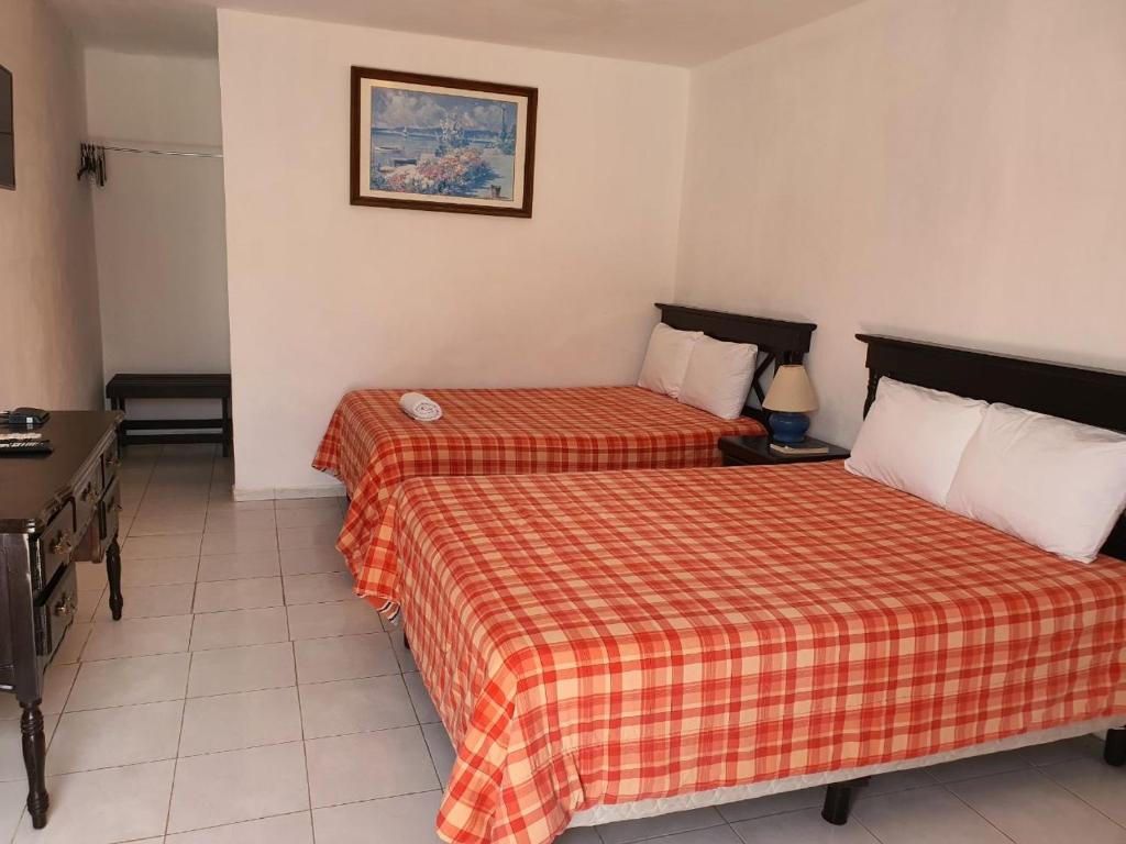 Двухместный (Двухместный номер с 2 отдельными кроватями) отеля Hospedaje Casa Holy, Мерида