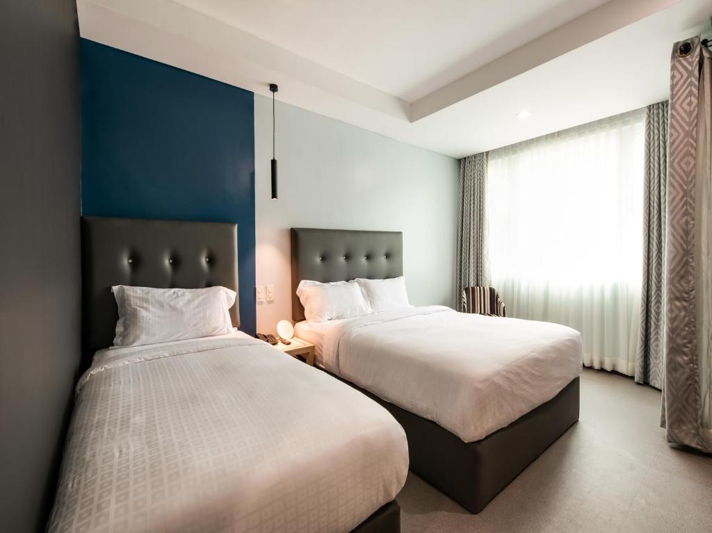 Двухместный (Стандартный двухместный номер с 2 отдельными кроватями) отеля OYO 207 Bay Area Suites, Манила