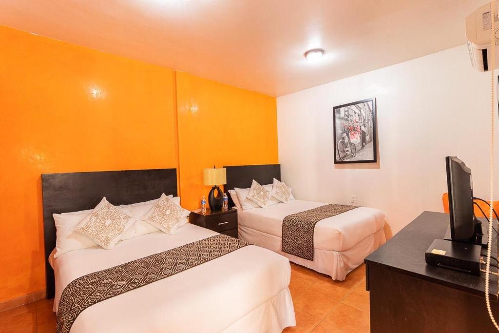 Двухместный (Двухместный номер с 2 двуспальными кроватями) отеля Hotel Doña Juana, Тлакотальпан