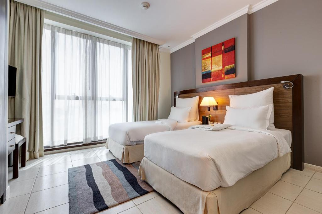 Апартаменты (Классические апартаменты с 2 спальнями - Включена поздняя регистрация отъезда до 14:00 и скидка 25% на еду и напитки) апарт-отеля Abidos Hotel Apartment Al Barsha, Дубай
