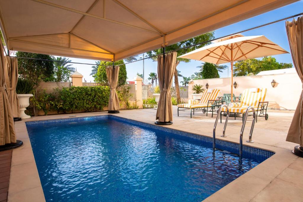 Сьюит (Семейные апартаменты с 2 спальнями и бассейном) курортного отеля Kempinski Hotel & Residences Palm Jumeirah, Дубай
