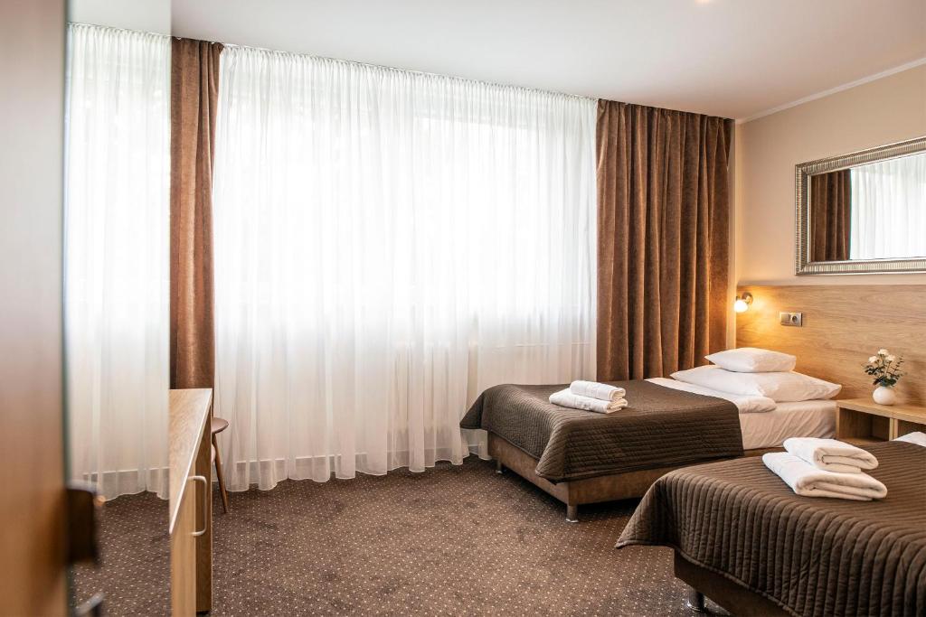 Двухместный (Улучшенный двухместный номер с 2 отдельными кроватями) отеля Hotel Boss, Лодзь