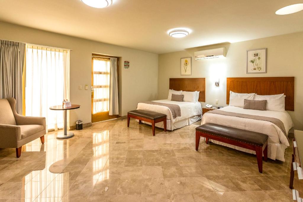 Двухместный (Двухместный номер Делюкс с 2 двуспальными кроватями) отеля Hotel Parador de Alcalá, Оахака-де-Хуарес