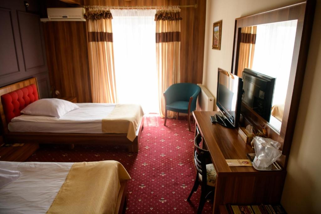 Двухместный (Двухместный номер с 2 отдельными кроватями) отеля Hotel Castel, Рымнику-Вылча