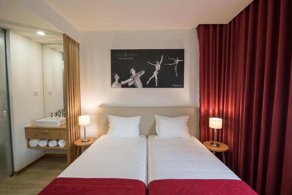 Двухместный (Двухместный номер Делюкс с 2 отдельными кроватями) отеля Porto Coliseum Hotel, Порту