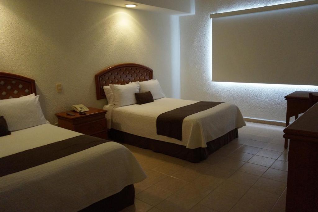 Двухместный (Двухместный номер с 2 двуспальными кроватями) отеля Hotel Costa Inn, Веракрус