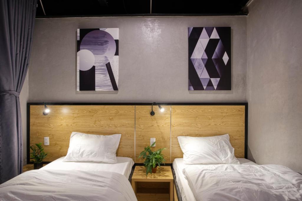 Двухместный (Стандартный двухместный номер с 2 отдельными кроватями) отеля THE NEST QUANG BINH, Донгхой
