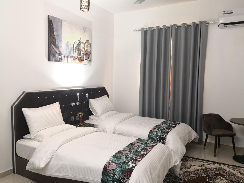 Двухместный (Двухместный номер с 2 отдельными кроватями и собственной ванной комнатой за пределами номера) апарт-отеля Aryaf Nizwa Hotel Apartments, Низва