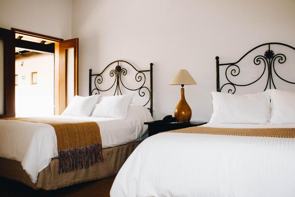 Двухместный (Двухместный номер с 2 двуспальными кроватями) отеля Hotel La Casona de Don Jorge, Колима