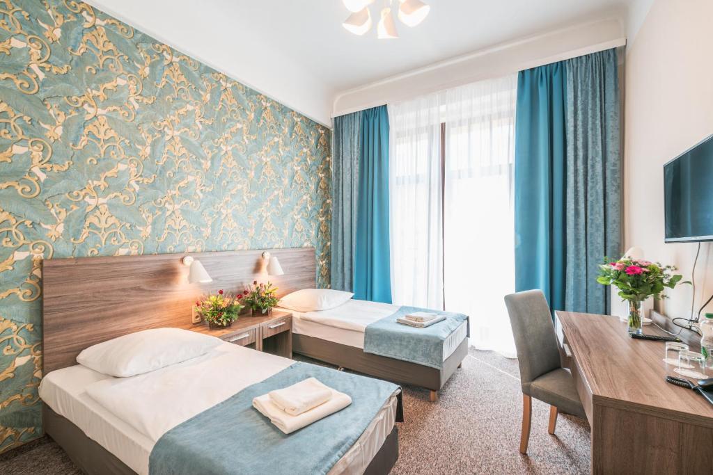 Двухместный (Улучшенный двухместный номер с 2 отдельными кроватями) отеля Hotel Polonia Centrum, Вроцлав
