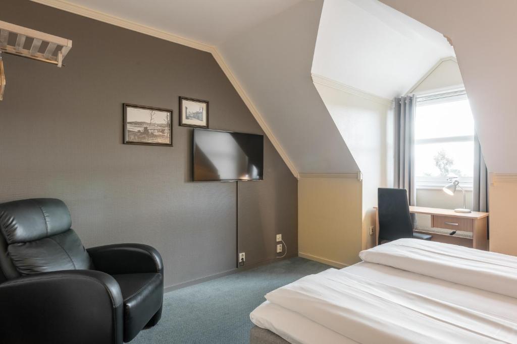 Четырехместный (Улучшенный номер с кроватью размера «queen-size») отеля Comfort Hotel Ole Tobias, Му-и-Рана
