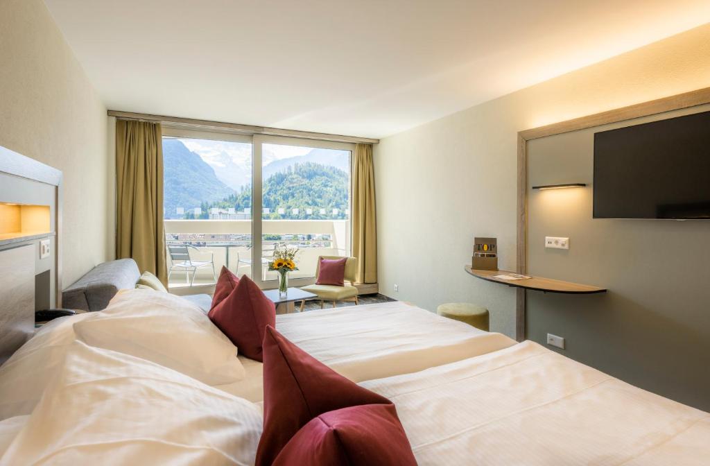 Двухместный (Двухместный номер Делюкс с 1 кроватью или 2 отдельными кроватями) отеля Metropole Swiss Quality Hotel, Интерлакен