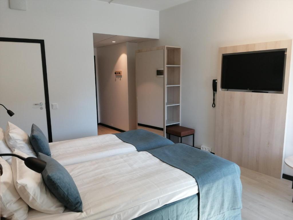 Двухместный (Двухместный номер «Комфорт» с 2 отдельными кроватями) отеля Airport Hotel Pilotti, Вантаа